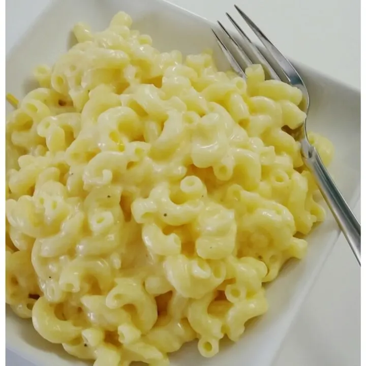 Ditch the packaged gluten free macaroni and make your own! Quick and easy recipe includes an insider tip of how to make the perfect creamy gluten free cheese sauce.