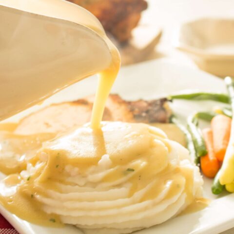 gluten free gravy poured over mashed potatoes