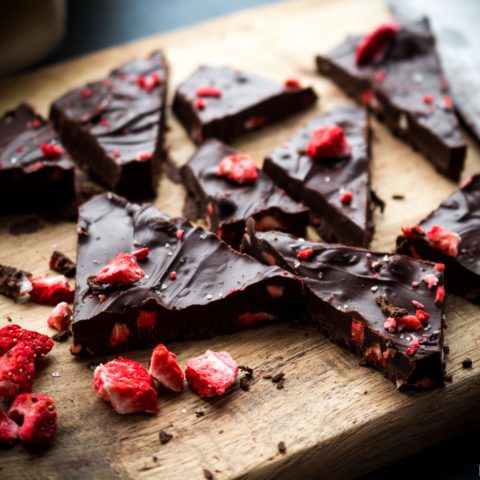 The elegance of chocolate dipped strawberries in an easy-to-make chocolate bark! Creamy melted chocolate is studded with crisp freeze dried strawberries and topped with Himalayan sea salt. It's a beautiful treat that is perfect for any occasion or holiday! Dairy free option.