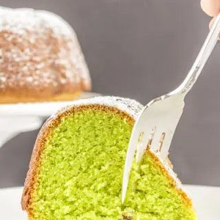 A show-stopping Pistachio Cake that is secretly easy to make with your favorite cake mix and a few other simple ingredients. #glutenfree #glutenfreecake #pistachiocake #LifeAfterWheat