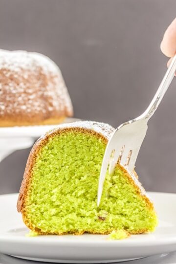 A show-stopping Pistachio Cake that is secretly easy to make with your favorite cake mix and a few other simple ingredients. #glutenfree #glutenfreecake #pistachiocake #LifeAfterWheat