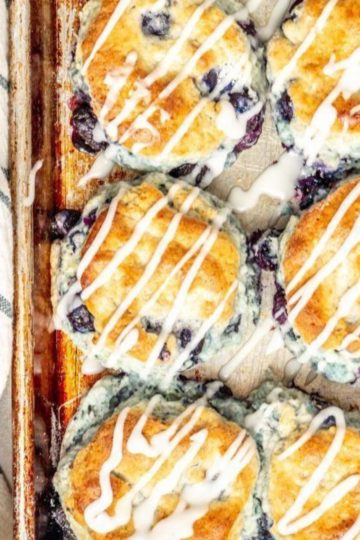 gluten free blueberry biscuits drizzled in a white glaze