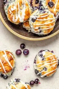 Perfect for breakfast or brunch, these beautiful gluten free blueberry biscuits are perfectly light and fluffy, slightly sweet, and studded with blueberries.