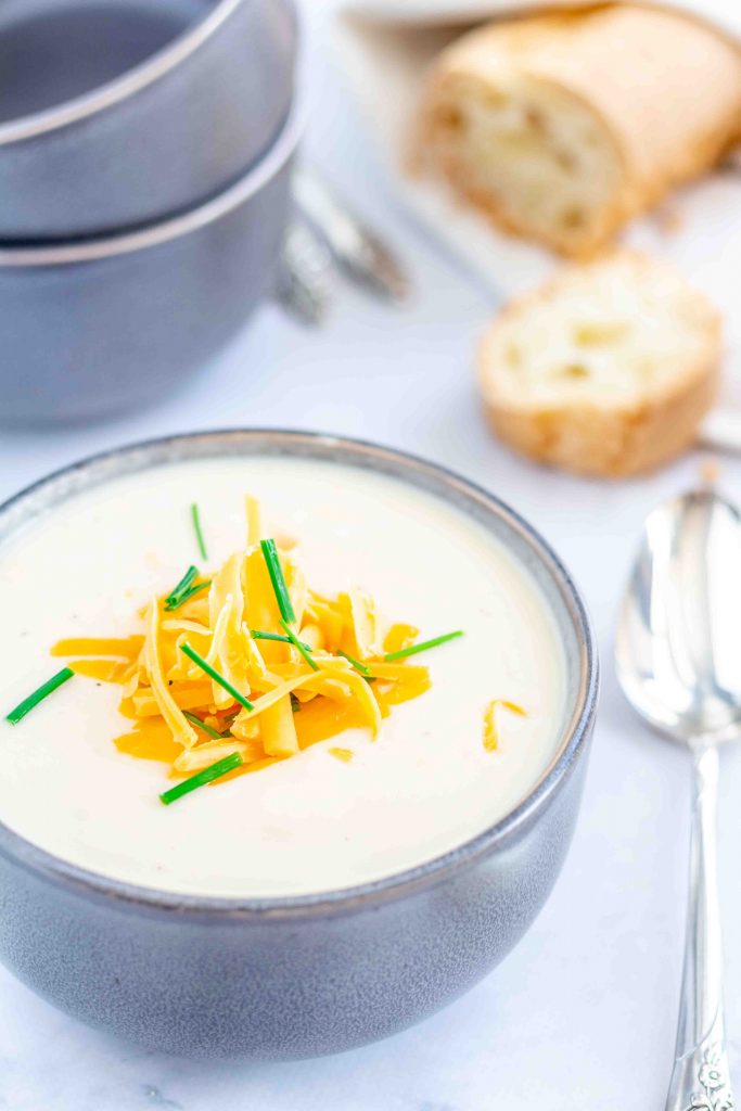 Instant Pot Cauliflower Soup is an easy dinner recipe and ready in 30 minutes. You'll love this gluten free cauliflower soup! #glutenfree #cauliflowersoup #instantpotsoup #cauliflowersouprecipes