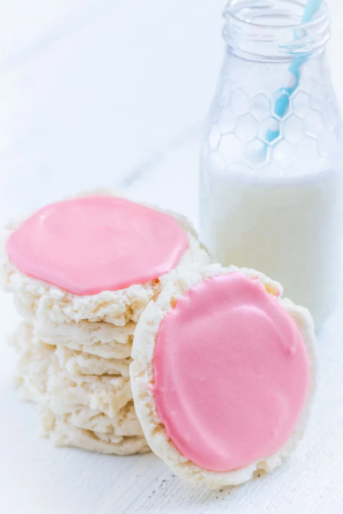 Swig cookies: A stack of sugar cookies with pink frosting and a glass of milk
