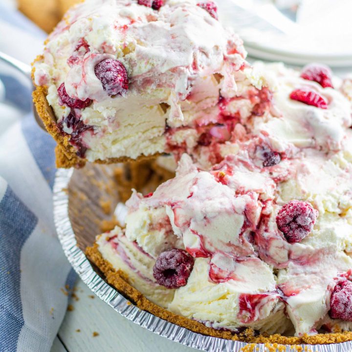 Vanilla ice cream with raspberries in a graham cracker crust