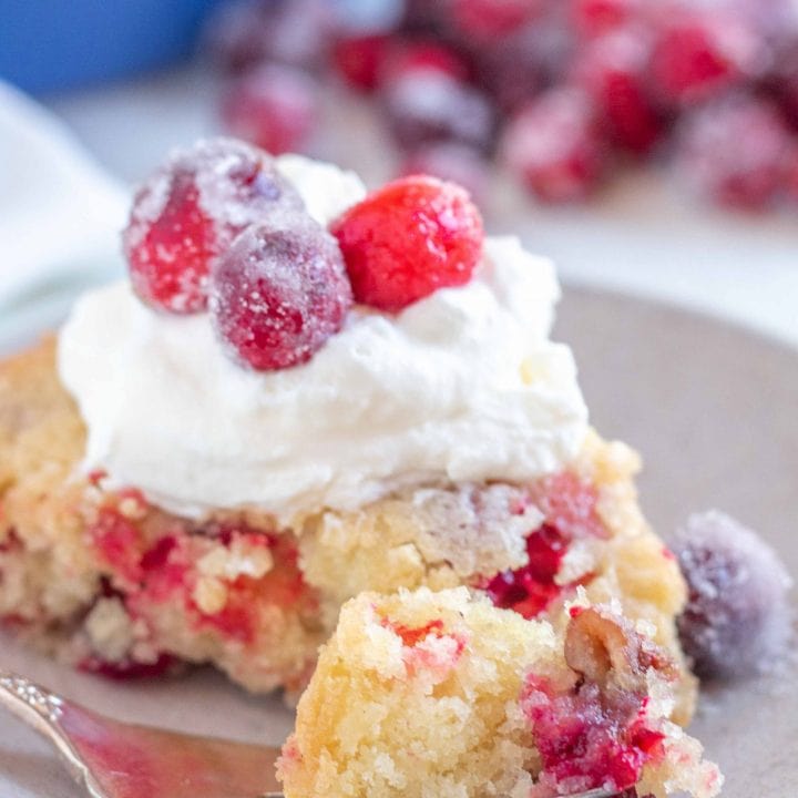 gluten free cranberry pie with whipped cream and sugared cranberries