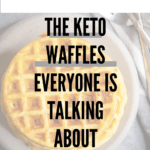 a stack of circular waffles sits on a gray stone plate next to a white and tray striped linen and a stack of tarnished silver forks. A text overlay reads "the keto waffles everyone is talking about