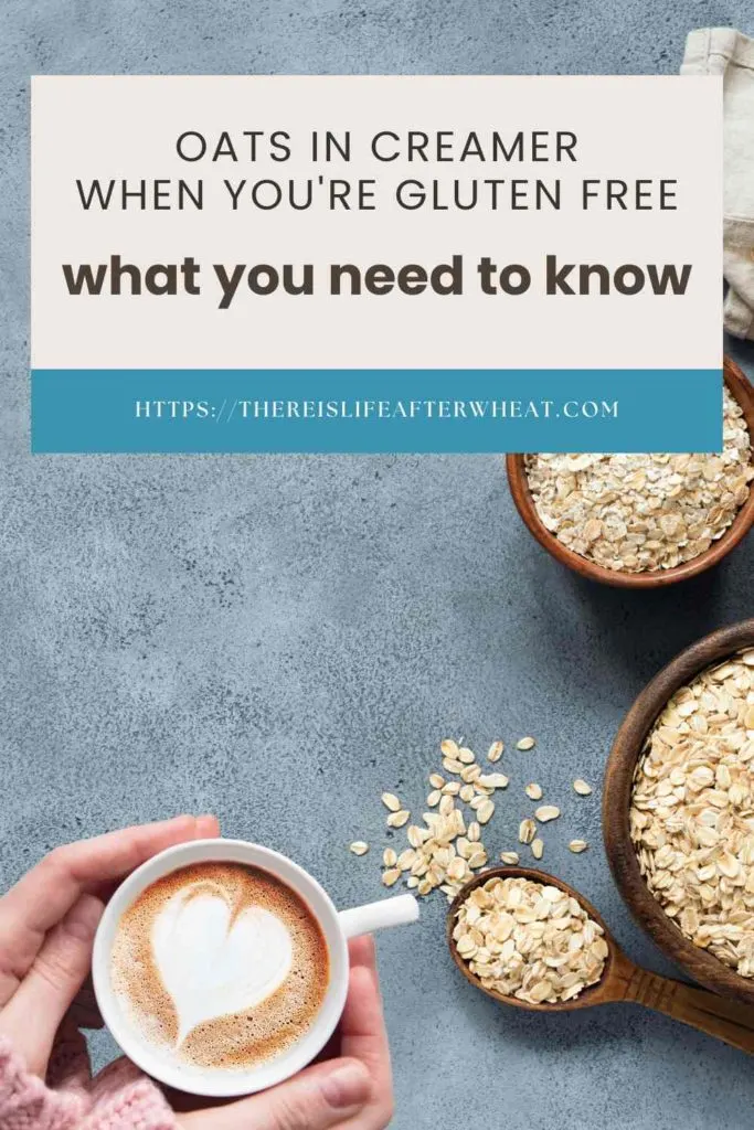 2 wooden bowls and a wooden spoonful are filled with oats and sitting on top of a blue textured background. There is a handful of oats scattered by the spoon, and a pair of hands hold a white mug of coffee with a white foam heart on top. The text says: Oats in creamer when you're gluten free: what you need to know"