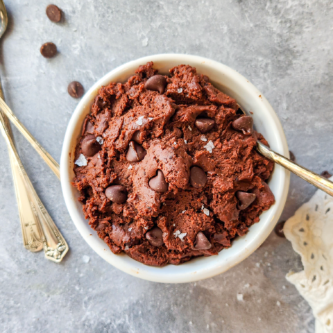 a white bowl filled with chocolate chip brownie batter