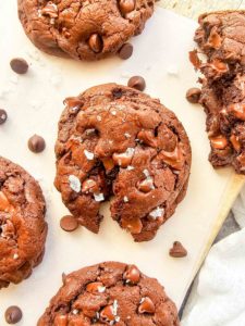 chocolate cookies are topped with melty chocolate and flaky salt.