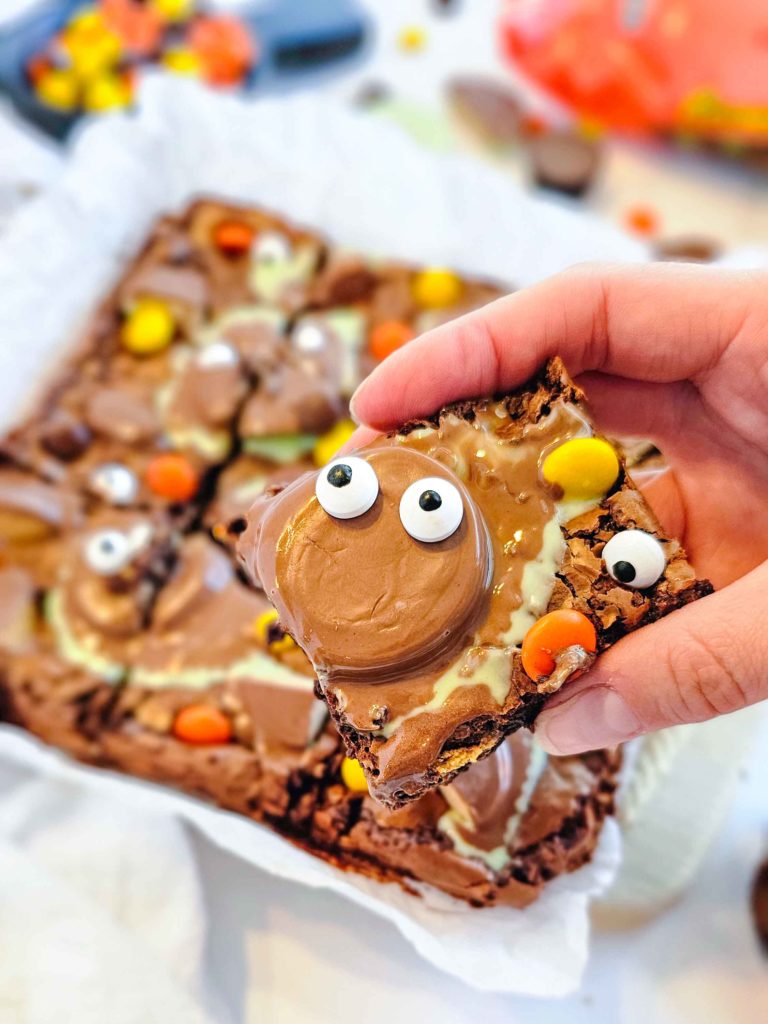 a gluten free Halloween brownie with a face made from a Reese's Cup + googly eyes