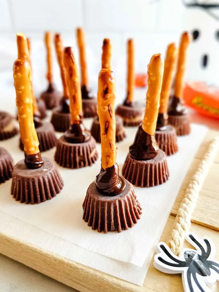 Mini Reese's cups with a pretzel attached to make a gluten-free witch's broom