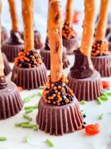 gluten free witch's brooms with halloween sprinkles