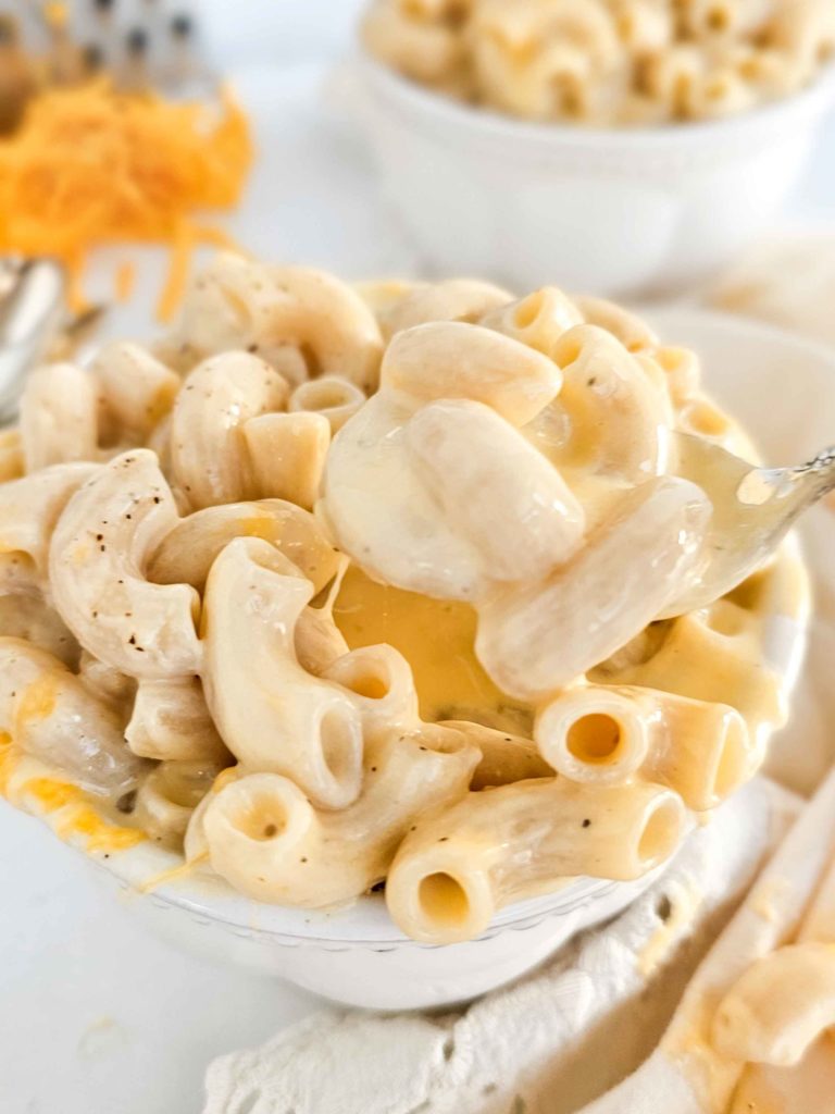 creamy mac and cheese in a white bowl
