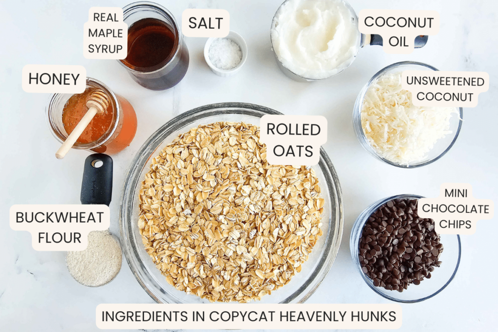 ingredients in Heavenly Hunks recipe: oats, coconut, buckwheat flour, salt, coconut oil, honey, maple syrup, chocolate chips.