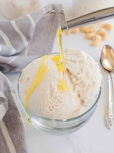 drizzling olive oil on dairy free vanilla ice cream