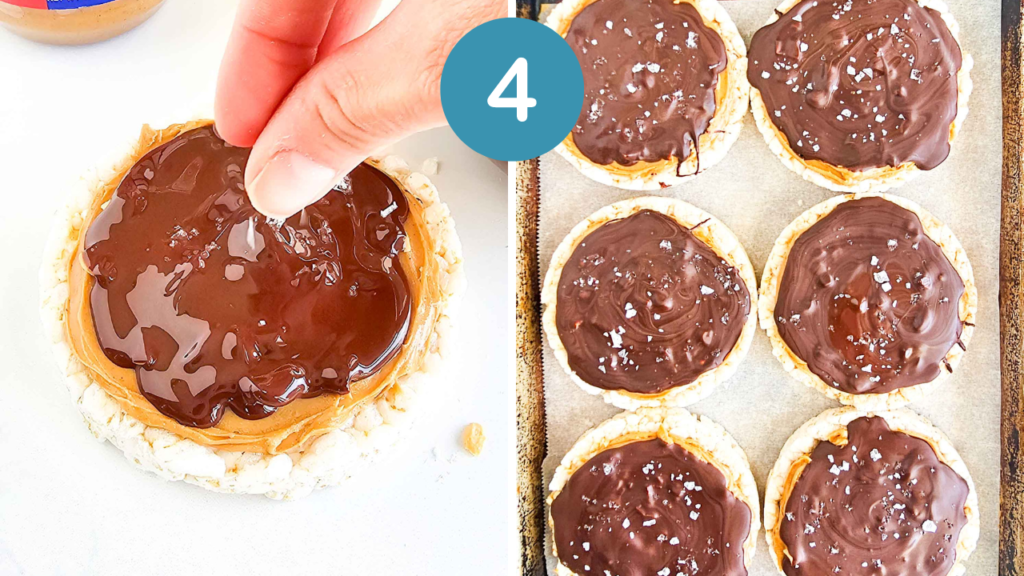 a hand sprinkling flaky salt on a chocolate covered rice cake