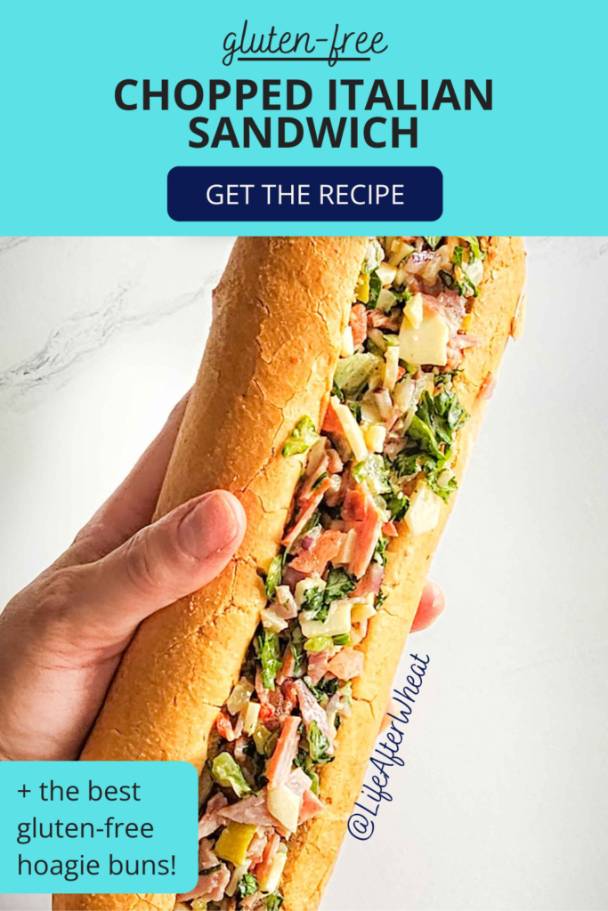 hand holding chopped italian sandwich